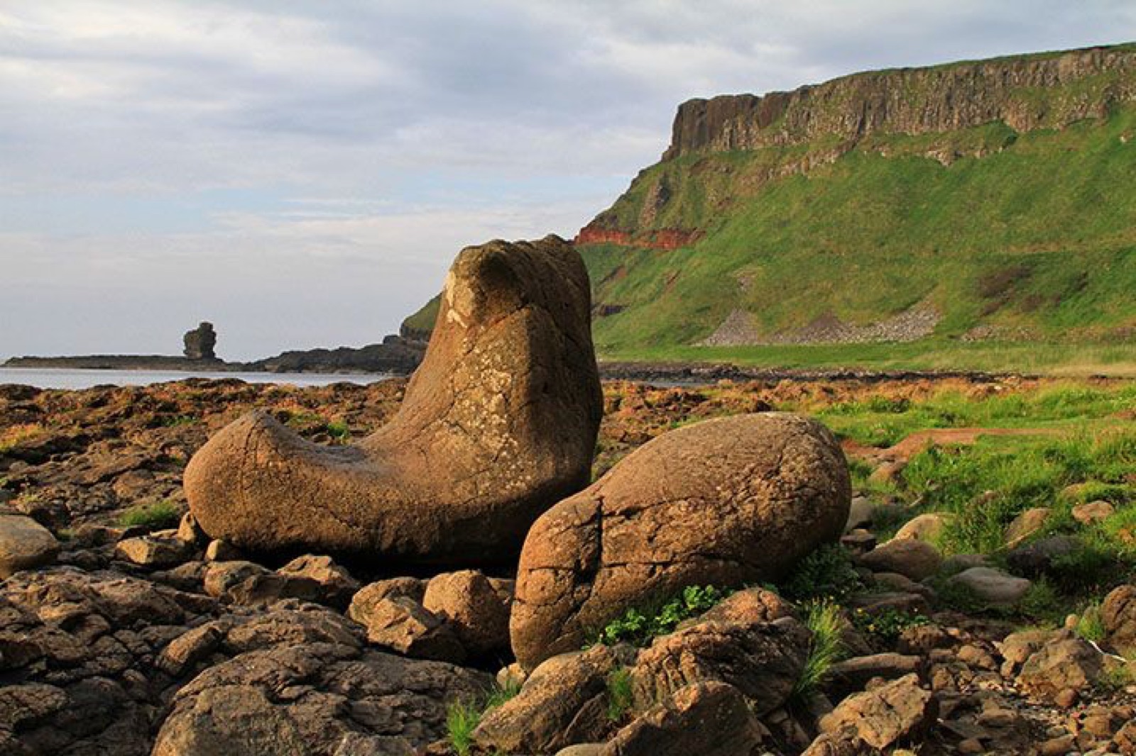 The Giant’s Boot, a large boot-shaped basalt rock formation on the shore near the Causeway cliffs